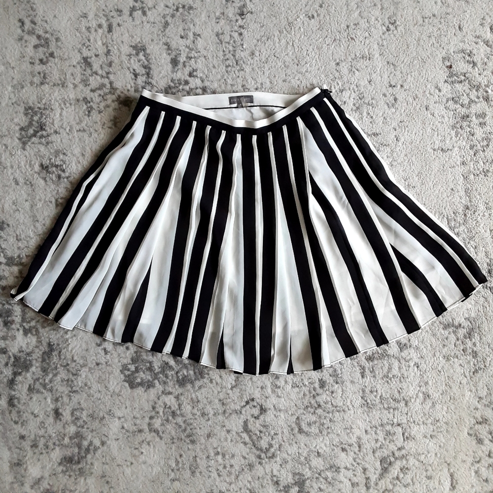 Black and white vertical striped pleated skirt